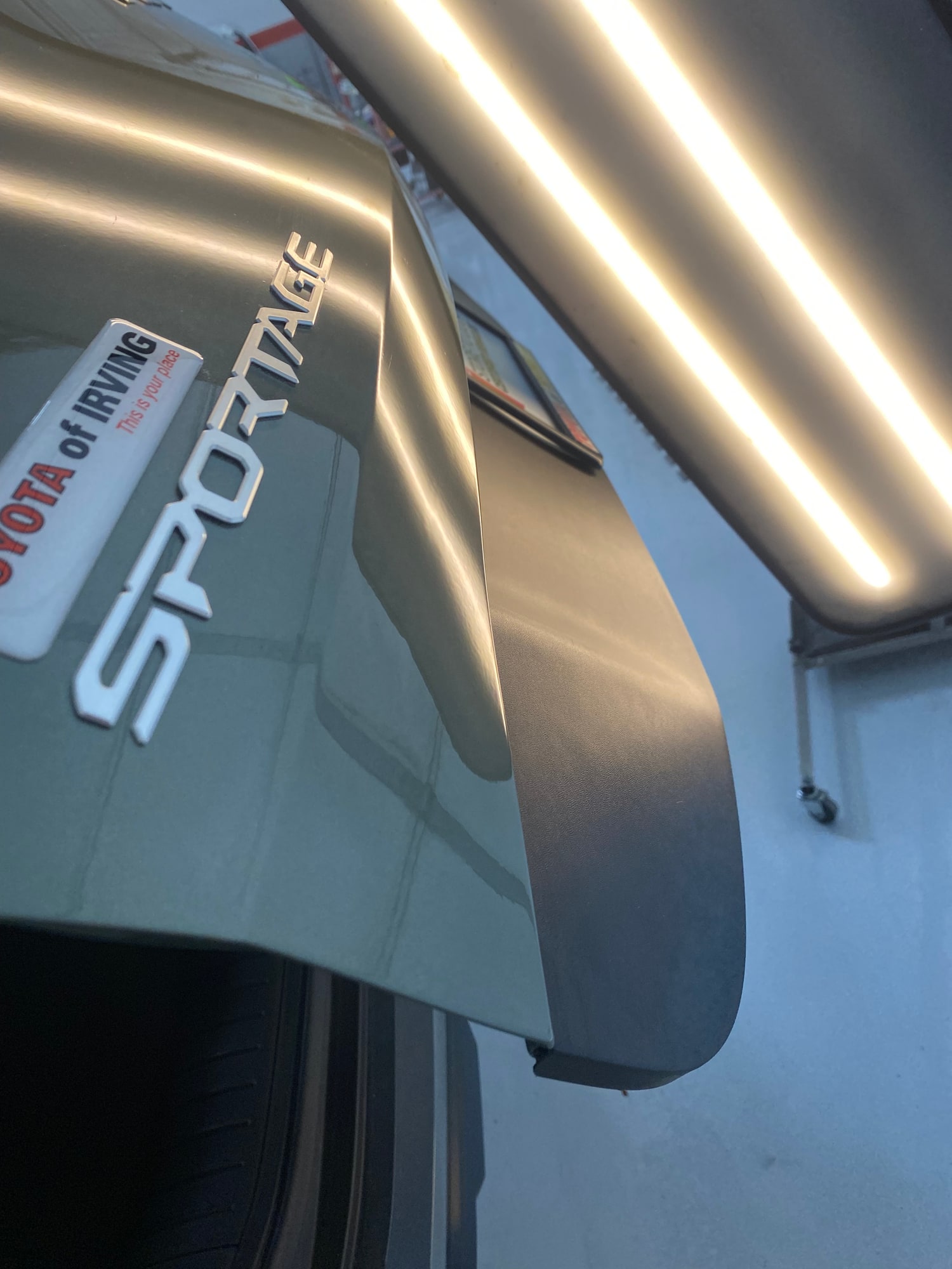 Tailgate dent repair after paintless dent repair