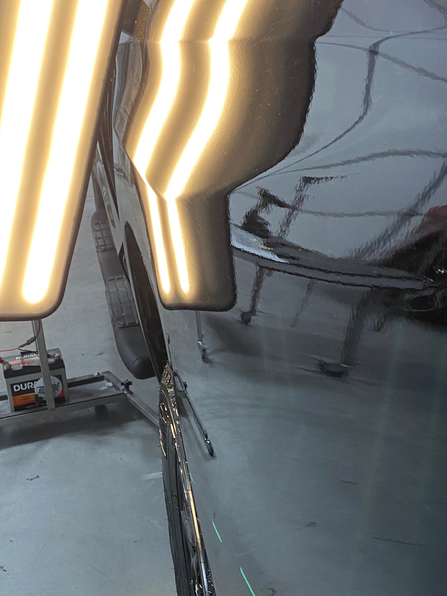 Door panel correction after paintless dent repair